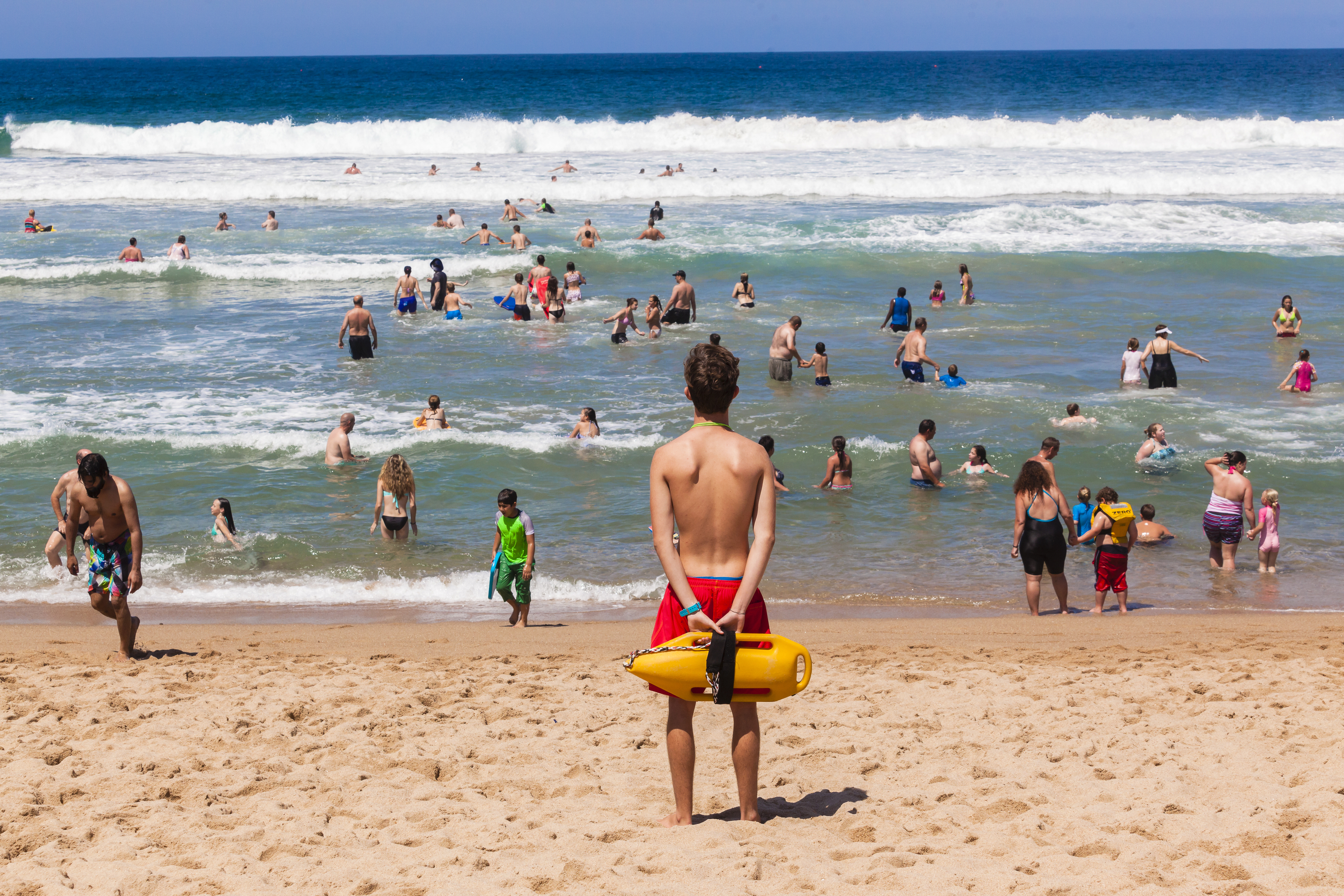 Lifeguard watches swimmers