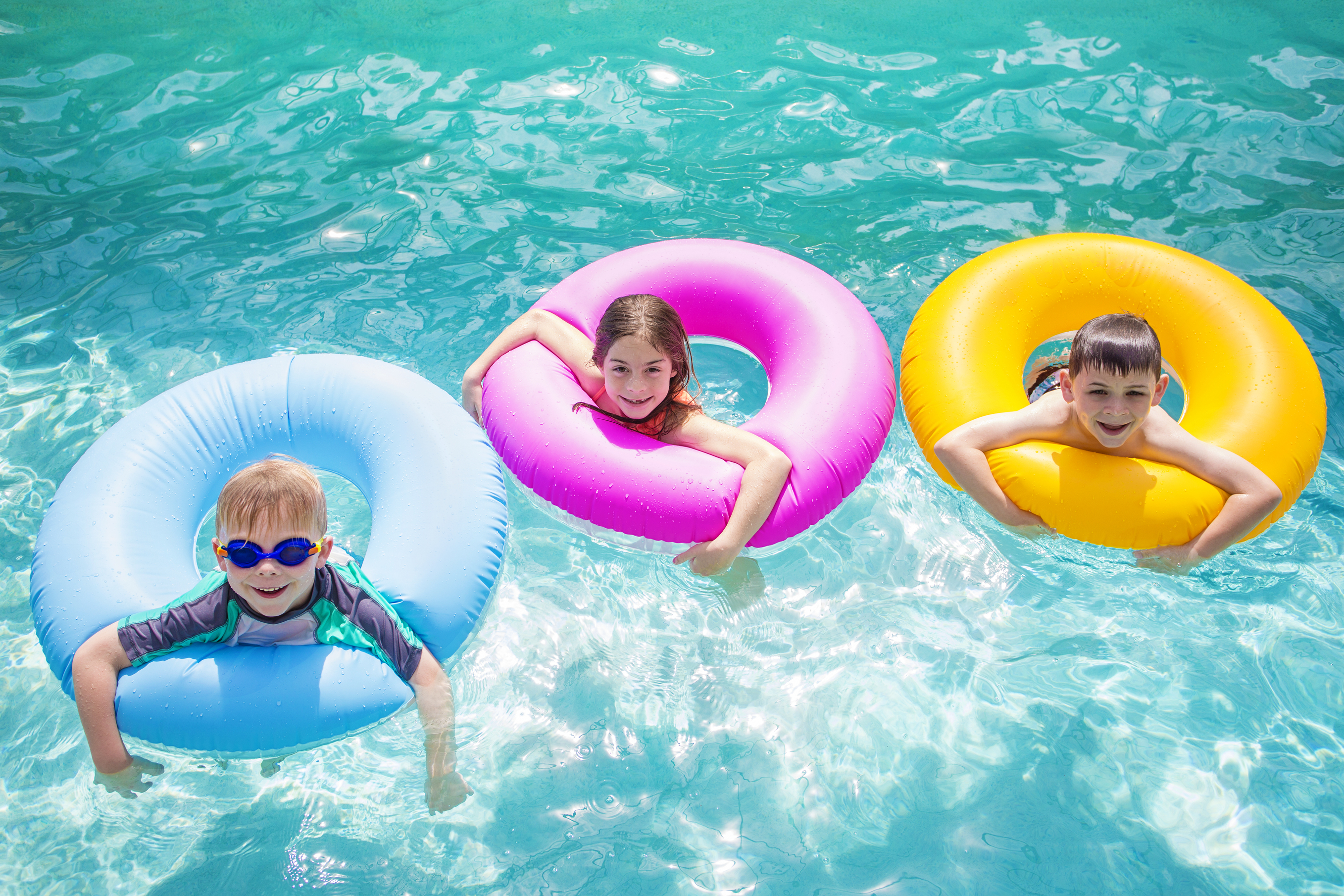 kids playing on inflatable tubes