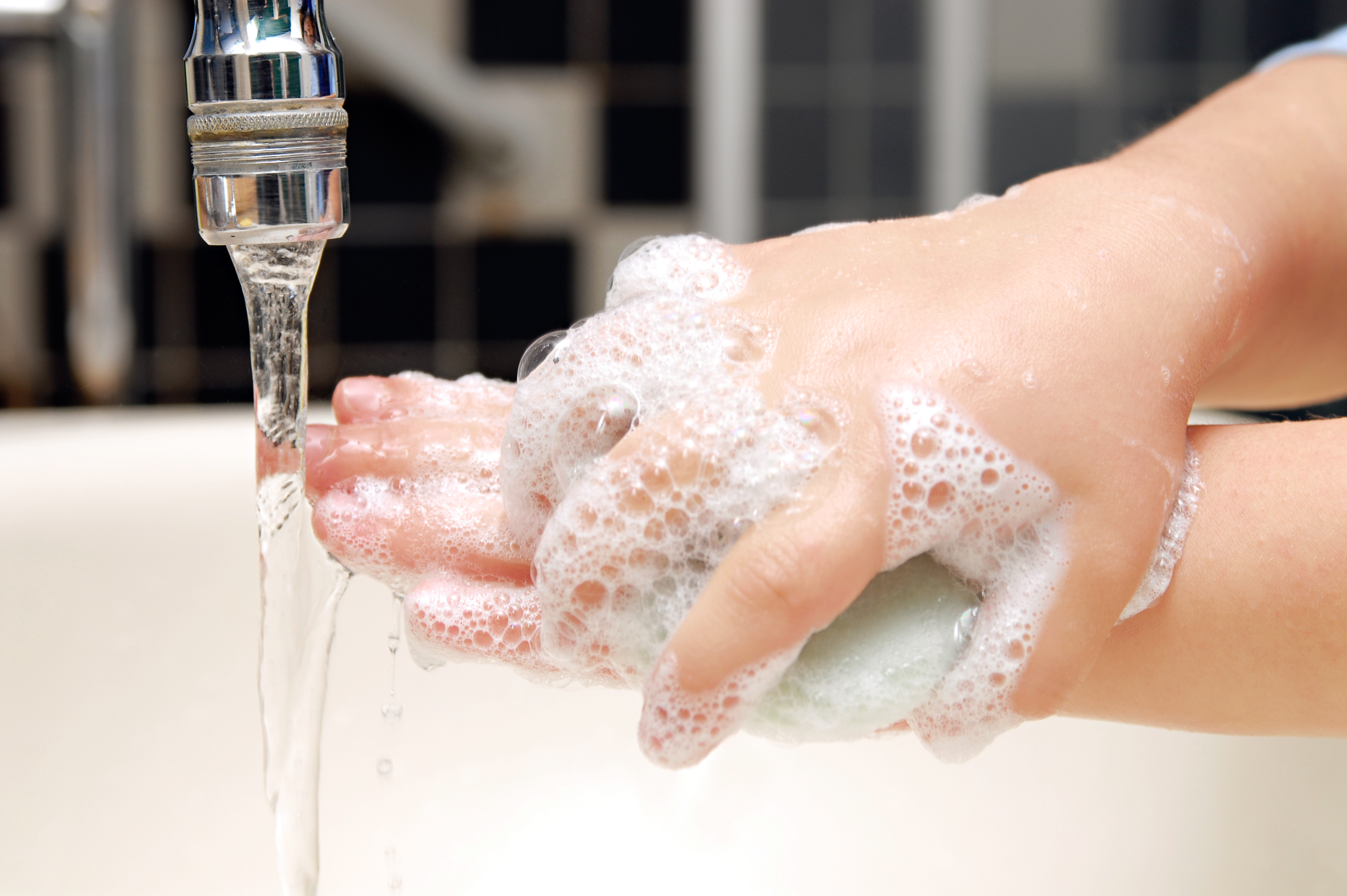 child washing hands